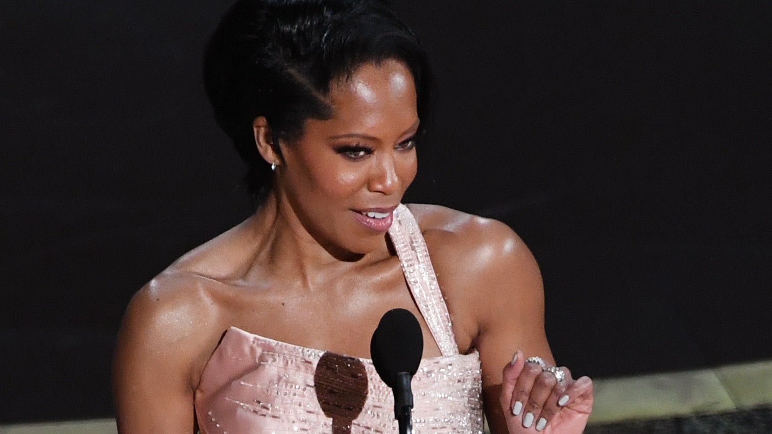 Include an image captionRegina King speaks onstage during the 92nd Annual Academy Awards on February 09, 2020. Photo: Kevin Winter/Getty Images